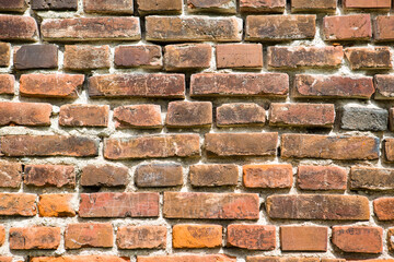 Background of red brick wall texture. Ruined castle.