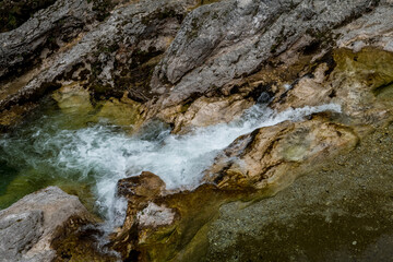 Clear Mountain River Flows Over Dam Between Rocks