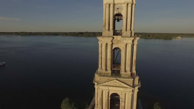 KALYAZIN, RUSSIA-15/08/2019: Fly over the water near the flooded bell tower in the middle of the Volga river in the city of Kalyazin