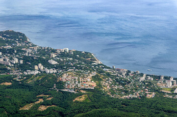 Summer aerial view on the city by the sea coast