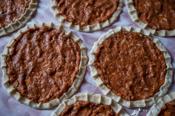 Top view of homemade pide, turkish flatbread with ground meat, mini pita breads or mini turkish pizzas