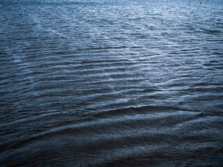 Naklejka premium small waves on the surface of the water