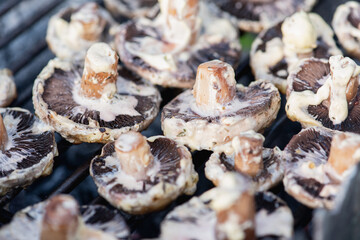 appetizing tasty fried mushrooms on the grid 