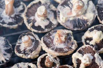 appetizing tasty fried mushrooms on the grid 