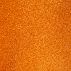 Leather. Close up orange color suede texture background