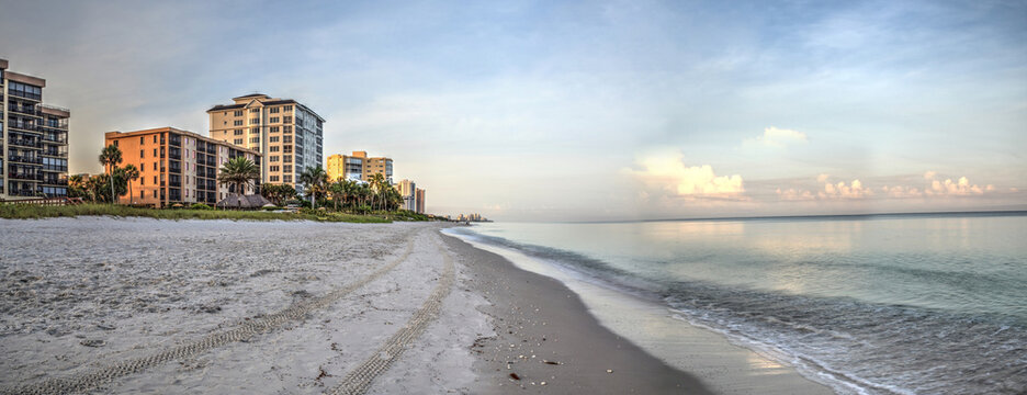 Vanderbilt Beach At Sunrise With A Calm Ocean