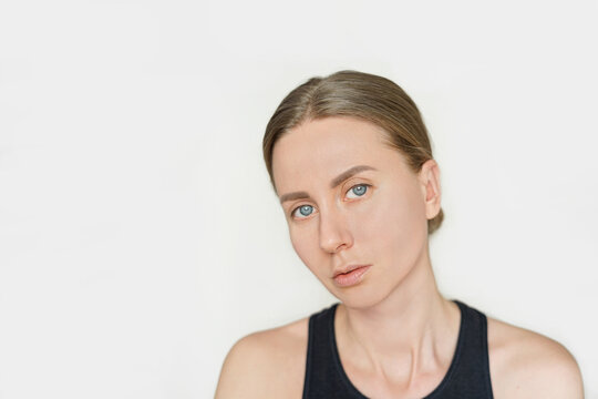 Beauty portrait of beautiful young caucasian woman without makeup on white. Head shot. Beauty, skin care, cosmetology