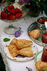 Lilac scones with strawberry curd in the summer garden
