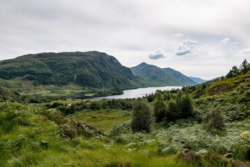 Fototapeta na wymiar Landscape of Scottish nature, green hills, Loch Shiel lake near Glenfinnan lookout in Scotland, United Kingdom