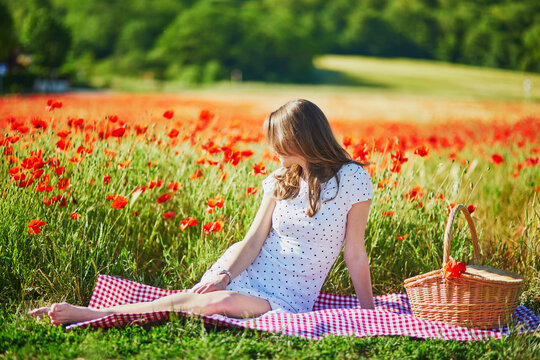 Beautiful Young Woman In White Dress Having Picnic