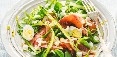 Summer salad with ham, asparagus, eggs and cheese