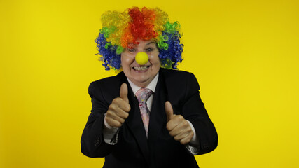Elderly clown businesswoman boss in wig show thumbs up. Halloween
