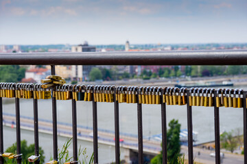 Panoramic view of Novi Sad from the Petrovaradin Fortress with padlocks in the foreground