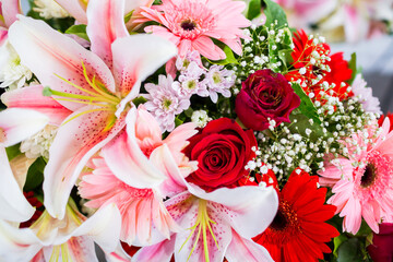 Selective focus to fresh flower bouquet. Botanic composition for wedding or greeting. Bouquet in multi color of beautiful mixed flowers. Excellent garden flowers in the arrangement , the work of a pro