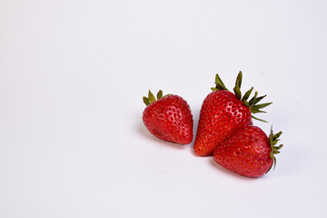 delicious strawberries ready to eat on white background