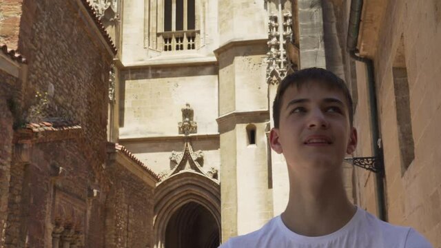 tourist on a trip visits the sights of the ancient European city of Oviedo in Spain on an antique street. Travel concept