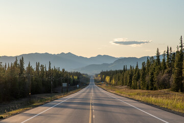 The iconic and amazing Alaska Highway outside of Whitehorse in Yukon Territory, northern Canada in...