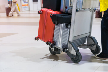 Traveler Tourists dragging trolley luggage, Baggage reclaimed Cancel flights stop, prevent COVID-19 virus disease, travel suitcase in airport that restrict to avoid world pandemic COVID-19
