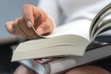 Reading books for education learning in textbook literature in home or academic on read desk at library school classroom. Relaxing or hobby to learn in knowledge, Education study concept