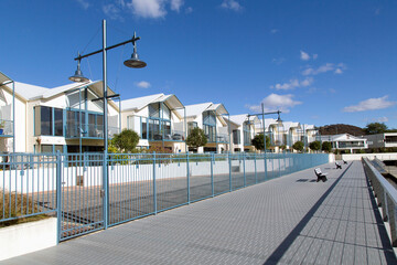 Expensive, luxury apartments surround the bay and marina at Alexandra Walk with coffee shops and restaurants.
