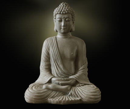 Portrait of a buddha statue, islated on dark background. Sign for peace and wisdom
