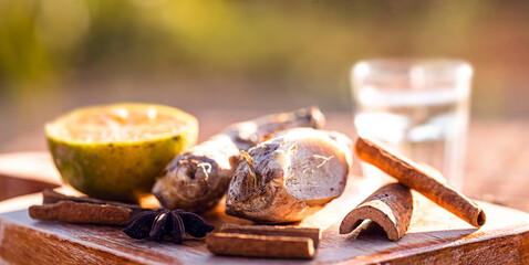 ingredients used to make winter drink, ginger, lemon, cloves, cinnamon sticks or anise. Ingredients for a Brazilian drink called 