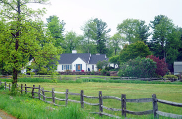 landscape of spring farm field and farm house