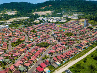 Aerial drone view of gated communities outside Guayaquil City, Ecuador and the main highway going to Via a la Costa. Shot from over houses and homes.