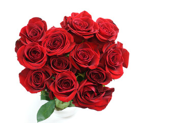 fresh red roses in a bouquet isolated on white background