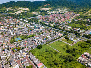 Fototapeta na wymiar Aerial drone view of gated communities outside Guayaquil City, Ecuador and the main highway going to Via a la Costa. Shot from over houses and homes.