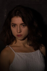 Female studio portrait in low light conditions