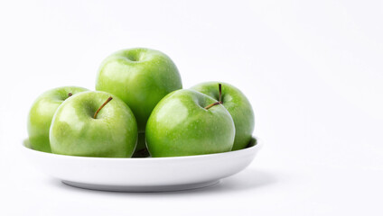 Fresh green apples in a dish on white background