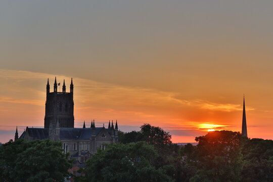 A warm sunset over the city of Worcester with a view of the cathedral and its tower. Worcestershire, England, UK. 