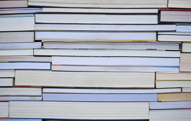 Used books background. Stacked books forming a background.