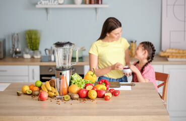 Blender and ingredients for smoothie on kitchen table