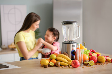 Blender and ingredients for smoothie on kitchen table