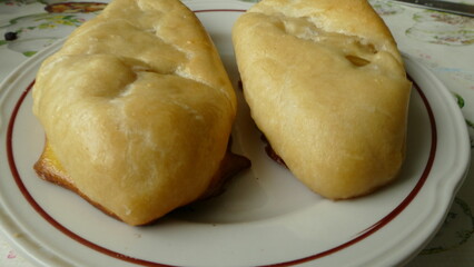 a woman cook made cabbage pies