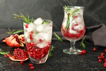 Glasses of healthy cocktail on dark background