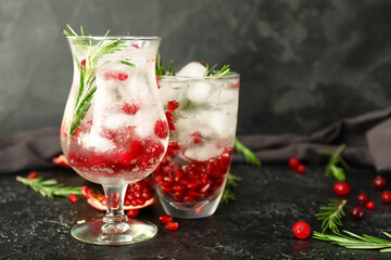 Glasses of healthy cocktail on dark background