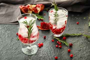 Glasses of healthy cocktail on dark background