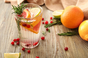 Glass of healthy cocktail on wooden background