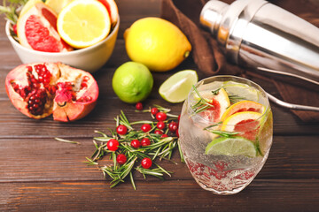 Glass of healthy cocktail on wooden background