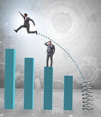 Businessman outperforming his competition jumping over
