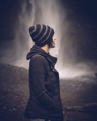 Beautiful Girl Enjoying The Outdoors and a Waterfall