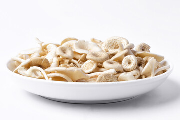 fresh whole mushrooms in a dish on white background