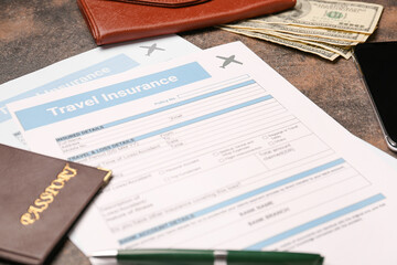 Travel insurance forms with passport and money on grey background