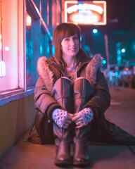 Beautiful Woman Enjoying The Neon Lights at Night