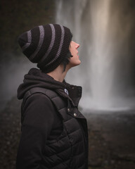 Beautiful Girl Enjoying The Outdoors and a Waterfall