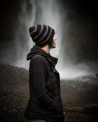 Beautiful Girl Enjoying The Outdoors and a Waterfall