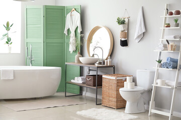 Stylish interior of modern bathroom with toilet bowl